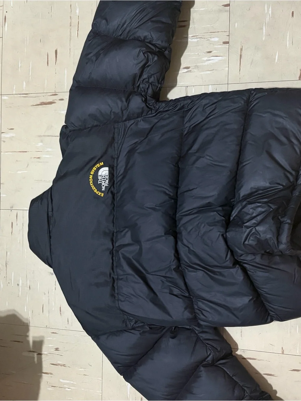 The North Face Black Puffer Jacket with Yellow Logo